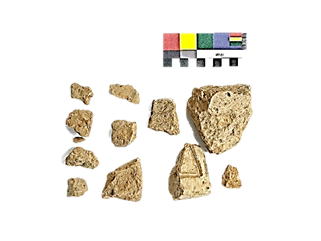 A group of rocks and a sample of a test  Description automatically generated with medium confidence